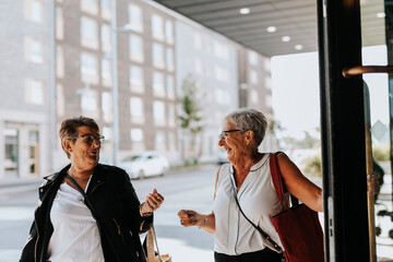 Senior women entering building