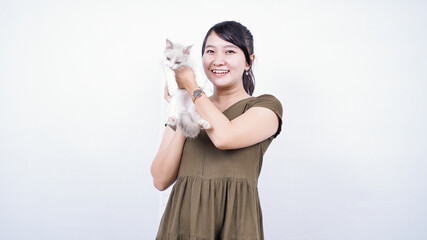 asian woman holding cat laughing isolated white background