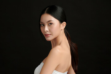 Beautiful young asian woman with clean fresh skin on black background, Face care, Facial treatment,...