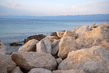 Fototapeta na wymiar Boulders on the Adriatic coast. Photographed in the evening.