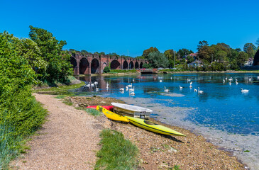 A view along the shoreline towards the railway viaduct at Fareham, UK in early summer