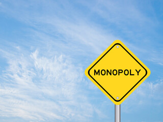 Yellow color transportation sign with word monopoly on blue sky background