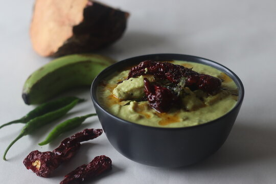 A cumin flavored yogurt based side dish with raw banana and elephant yam cooked in a coconut gravy. A main side dish of Onam meals popularly called Kalan curry.