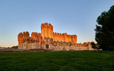 Coca Castle at sunset, province of Segovia, Spain.