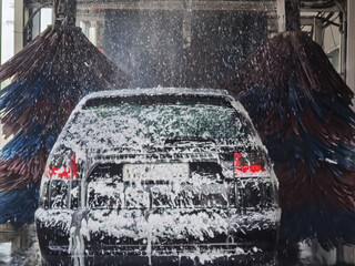 car wash glass foam water and brushes