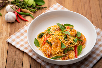 Thai fusion food.stir fried pasta with spicy chilli and shrimp mix with green peppercorn Fingerroot...
