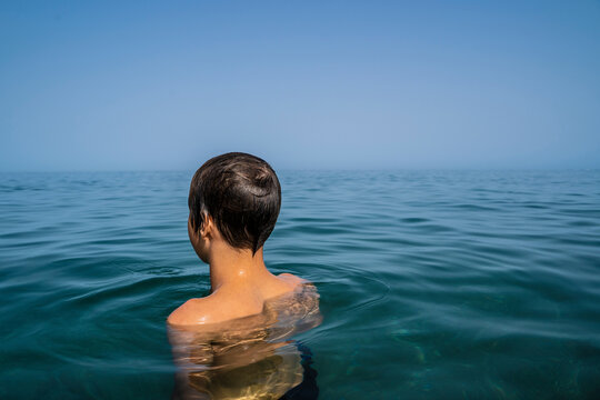 Teenage boy in sea