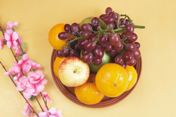 Grapes,Oranges and Apples put on background