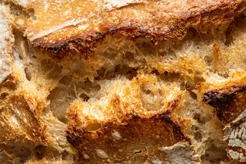 Abwaschbare Fototapete Makrofotografie Sourdough bread close-up. Bread crust macro details.