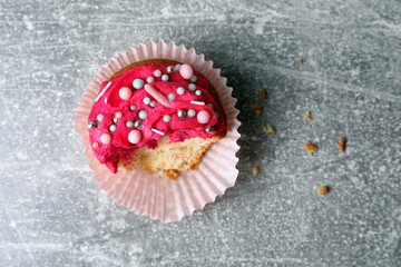 Failed cupcake on light grey table, top view. Troubles happen
