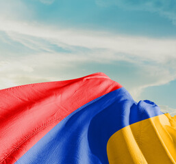 Armenia national flag waving in beautiful clouds.