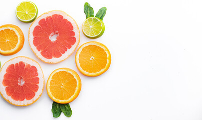Citrus fruits on a white background are cut . Colored fruits. The citrus family. citrus sliced layout top view on a white background. An article about healthy eating. Keto diet.