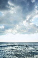 Naklejka na ściany i meble Blue seascape with horizon over water.