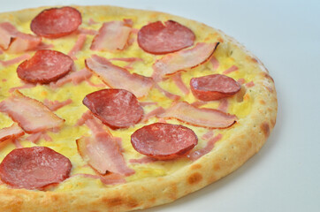 pizza with salami tomato and olives. on white background