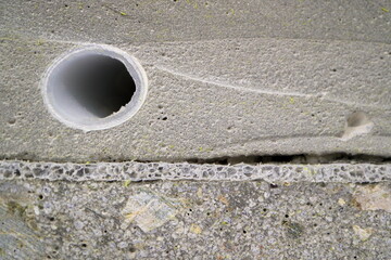 The image of a section of a composite construction slab. Multilayer building slab. Composite foam concrete.