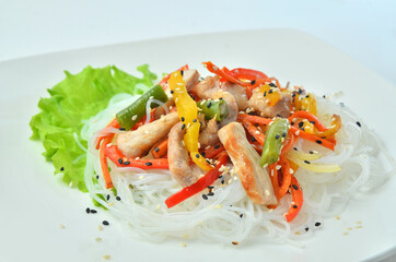 asian cooked udon noodles White plate with wok with seafood