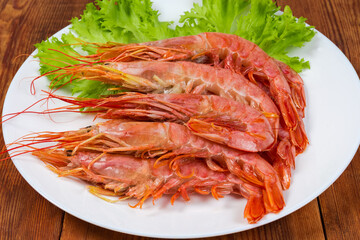 Boiled Argentinian red shrimps on dish, close-up