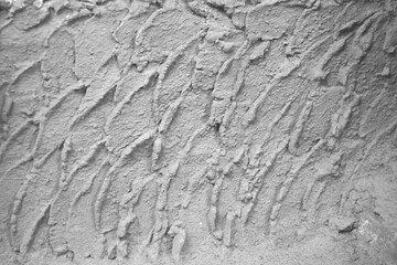 Cement wall with rough embossed seamless patterns for grey background