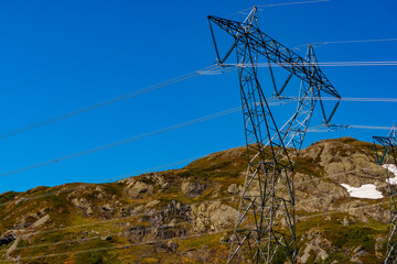 Power line voltage tower in mountains