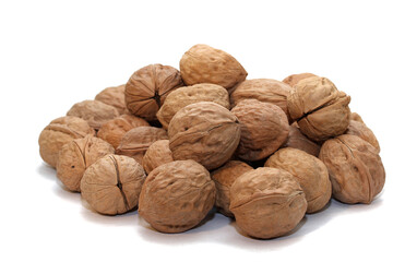 Pile of closed walnuts isolated on white background 