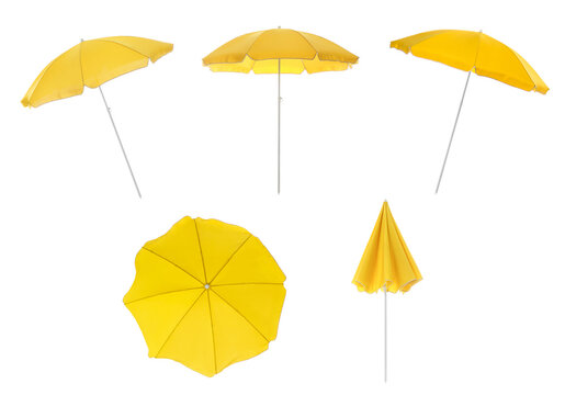 Set with yellow beach umbrellas on white background