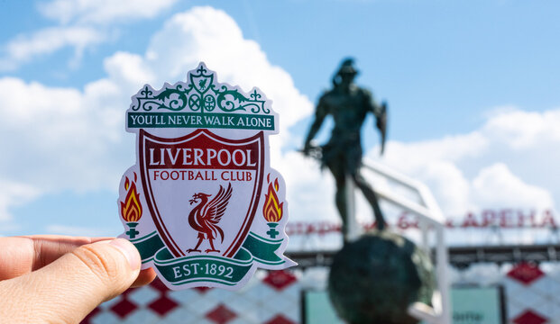 June 14, 2021 Liverpool, UK. Liverpool F.C. Football Club emblem against the backdrop of a modern stadium.