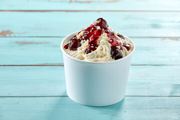 German vanilla ice-cream spaghetti with black cherries