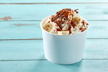 Serving of German vanilla ice cream spaghetti topped with banana