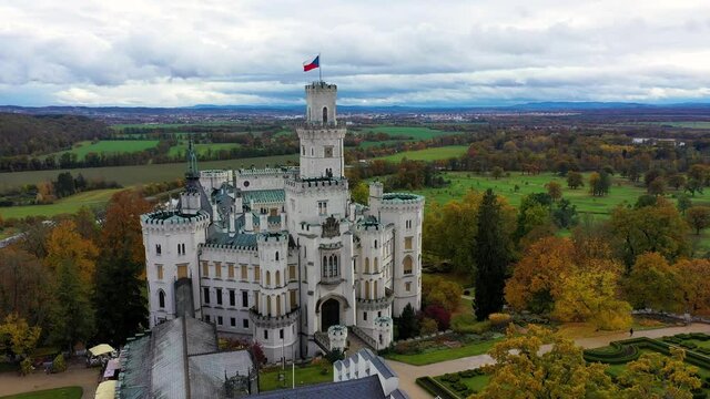 Drone view of medieval castle in Hluboka nad Vltavou, Czech Republic. Castle Hluboka nad Vltavou is one of the most beautiful castles in Czech Republic. Hluboka nad Vltavou in autumn with red foliage
