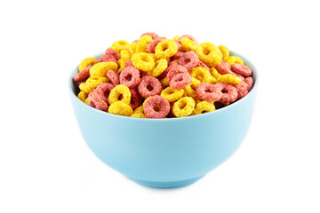 Colorful cereal loop rings on blue bowl isolated on white background. Breakfast food.