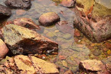 Rock Stones and Cristal Clear Water yellow Background