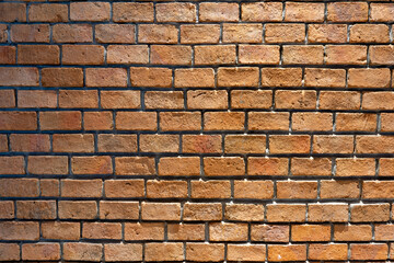 Photo of a wall made of red bricks, background from a wall built inside a building