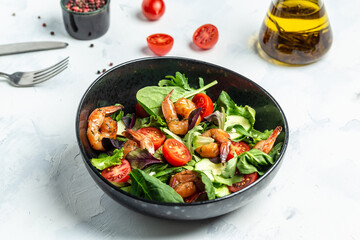 Dietary menu. Healthy vegan salad of smoked shrimps, cherry tomatoes, cucumber and mixed leaves. Healthy eating concept. Detox diet. Vegetarian lunch. Weight loss, top view