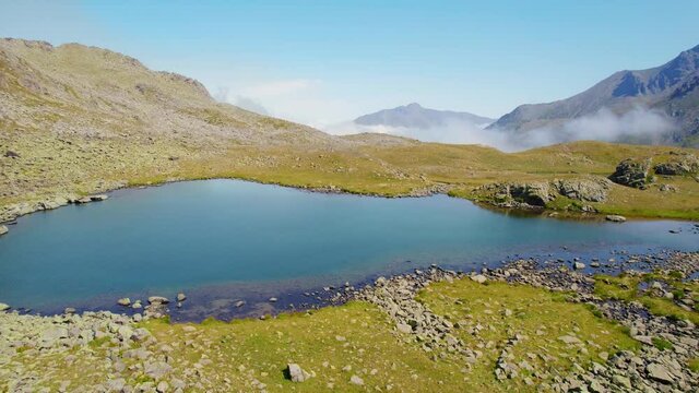 hiking near beautiful mountain lake, aerial view of sunny mountain landscape in Kackar, Turkey, clear water, sunny alpine landscape 