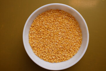 Some lentil grains on a clay bowl 