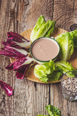 Raw organic purple radicchio and lettuce with salad dressing