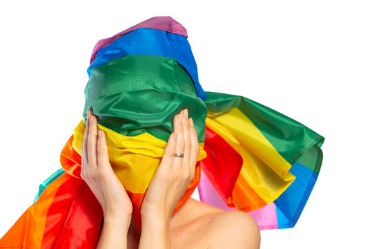 unrecognizable woman wrapped in rainbow flag isolated on white. The concept of LGBT anonymity, secrecy.