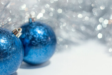 Christmas greeting background, blue balls on silver background. High quality photo