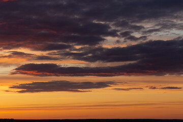 The evening sunset. Panorama. Majestic Storm Clouds. Tragic gloomy sky.