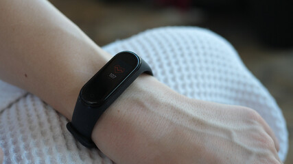 Close-up of a man using a smart watch measures his pulse. Pulse checker app. Smart watch. Wearable...