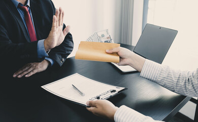 Government officials raise the hand refusing money to take the bribe from businessman the concept...