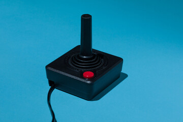 Vintage joystick with red buton on blue background - 453156510