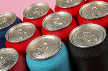 several aluminum soda cans in assorted colors