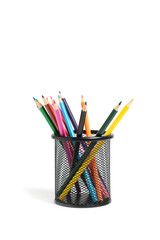 Office basket with colored pencils on a white background.