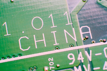 Phone, smartphone in the hands of an older woman. The problem of IT technologies, the introduction of gadgets. Natural green background. Copy space