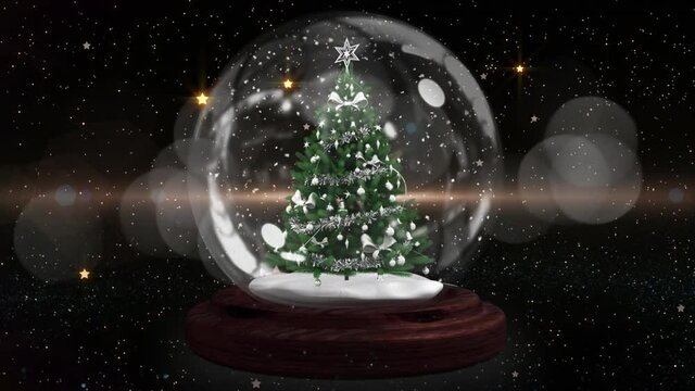 Blue shooting star around christmas tree in a snow globe against spots of light on black background