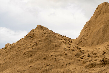 Coarse Sand pile and Find Granular Sand pile and fill Sand pile. used to make concrete  , to create  path , to create  floor. Sand texture , Sand  background and Sand isolated.