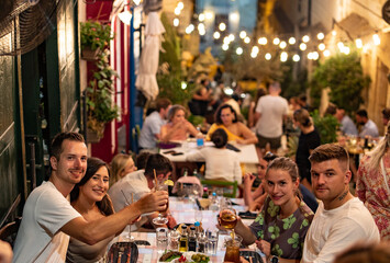 Friends having a dinner in Valletta stairs