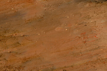 Dig up the ground by bucket of excavator or backhoe. The soil is earth tone.