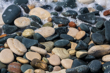 wet pebbles on sea beach 
